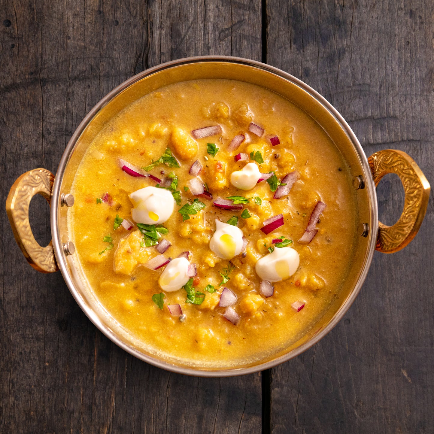 Decorated Golden Lentil Dahl Curry in Bowl - Eat Proper Good